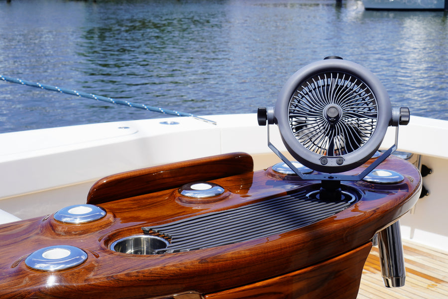 MistOne secured in a boat cup holder with water in the background.