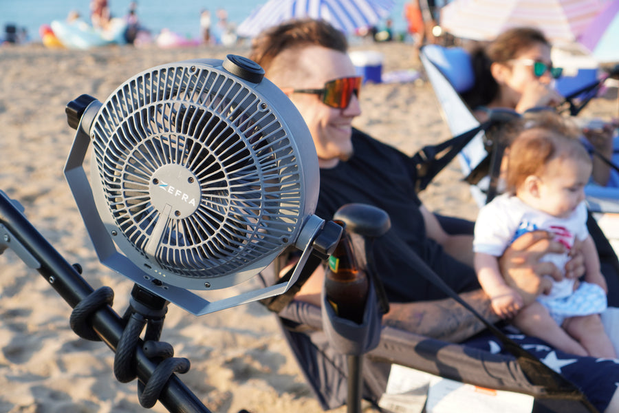 MistOne beside a family relaxing together on the beach.