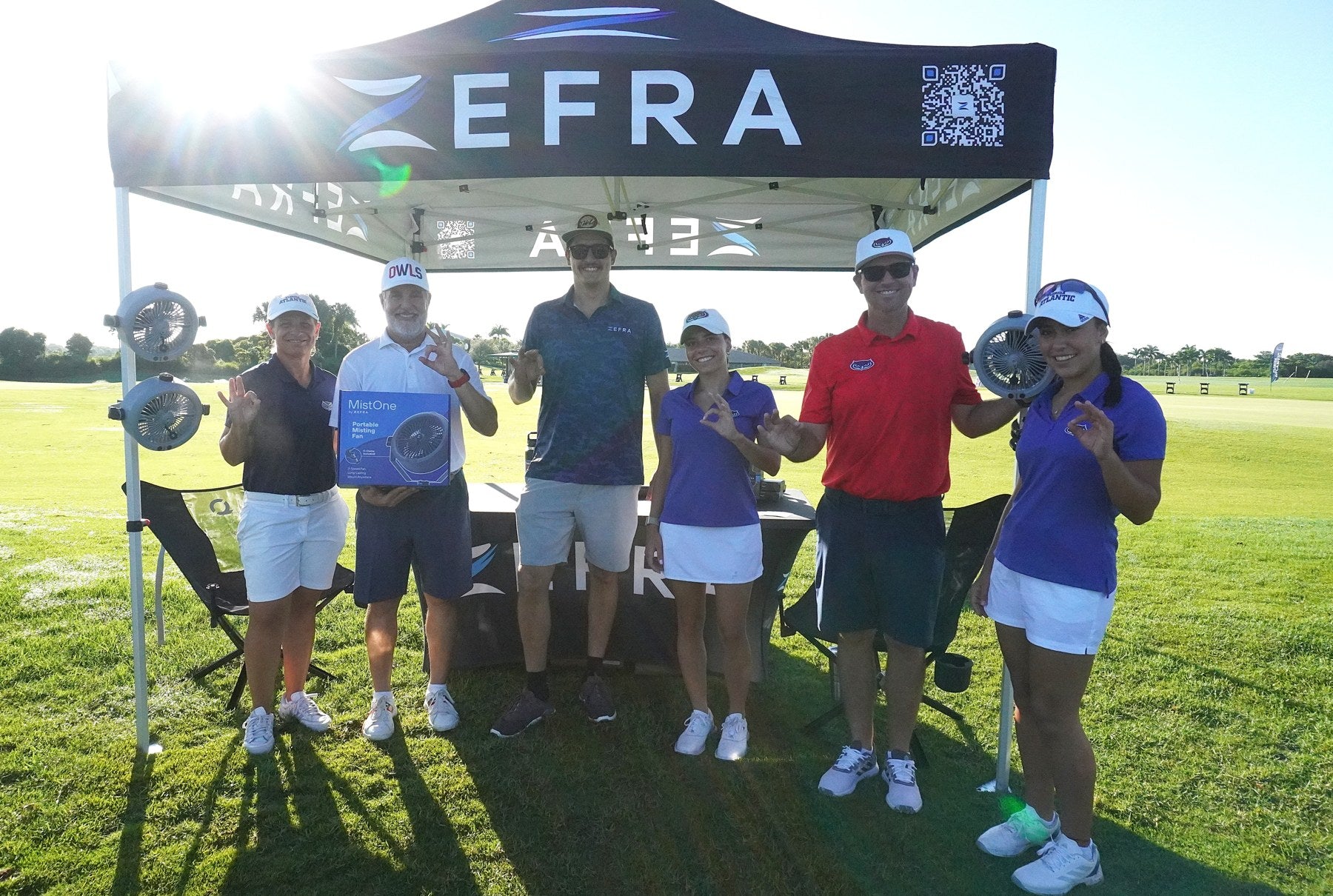 Scott with the group under the Zefra tent at an FAU golf event.