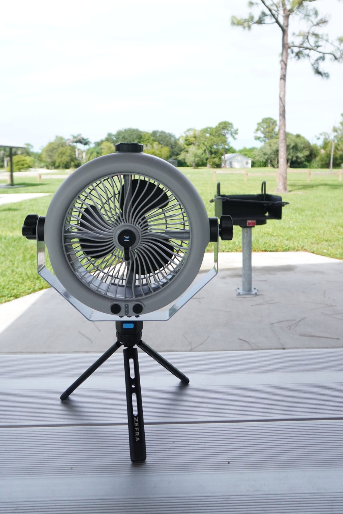 MistOne on the optional Tripod mount on a picnic table under a park shelter.